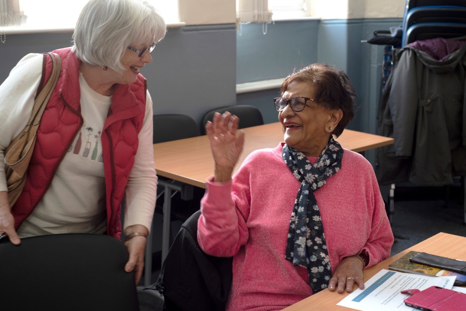 Carers chatting and sharing experiences at a local support group session
