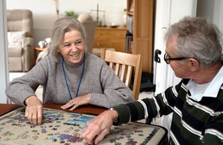Volunteer spending time with a carer during a Carers Support break session.