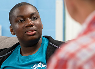 Young carer talking to a support worker