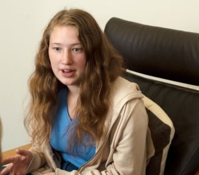 Young carer sharing their views during a group discussion.